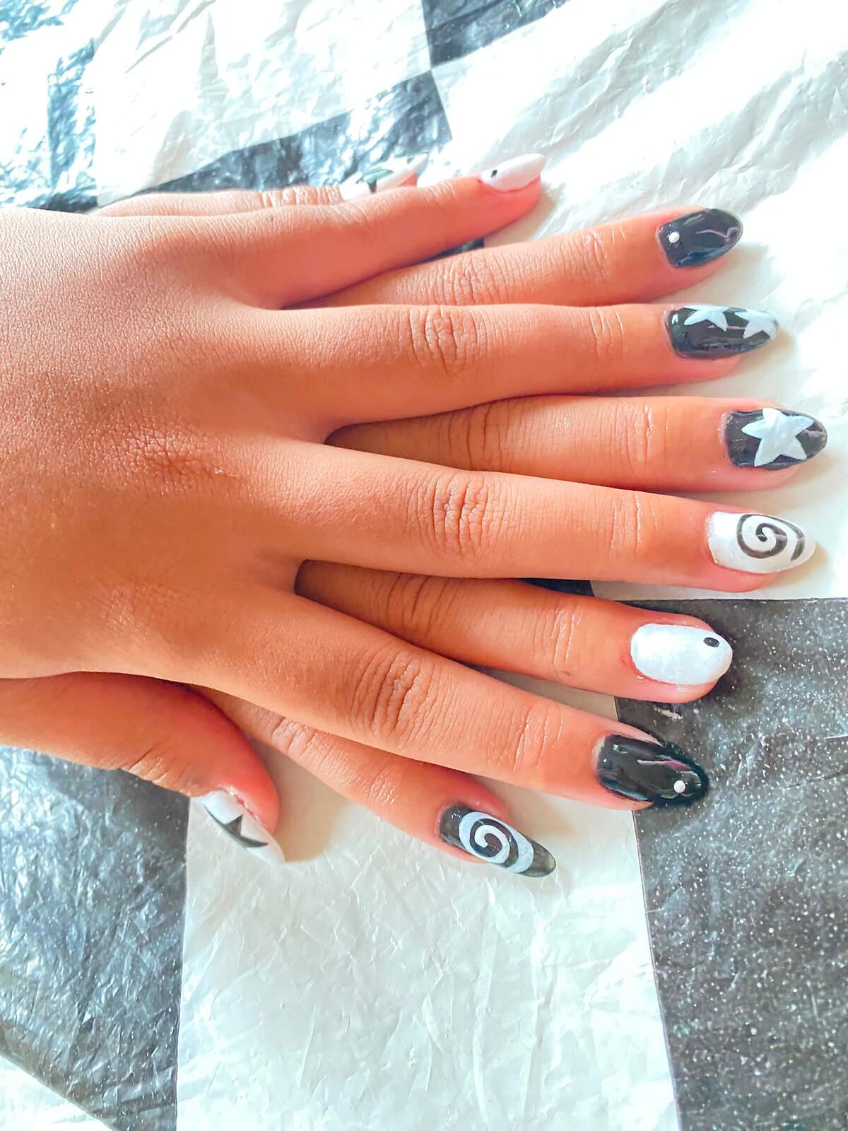 Black and white star and swirl nail art